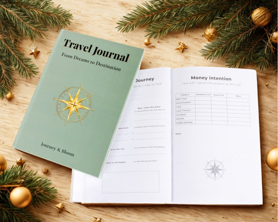 Travel journal with open pages on a wooden surface with Christmas decorations